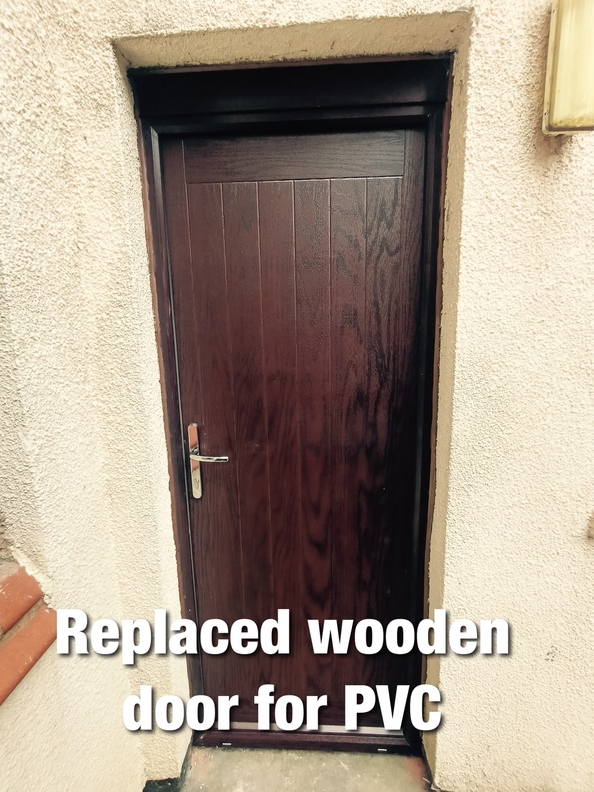 Old wooden side door replaced with a new PVC door