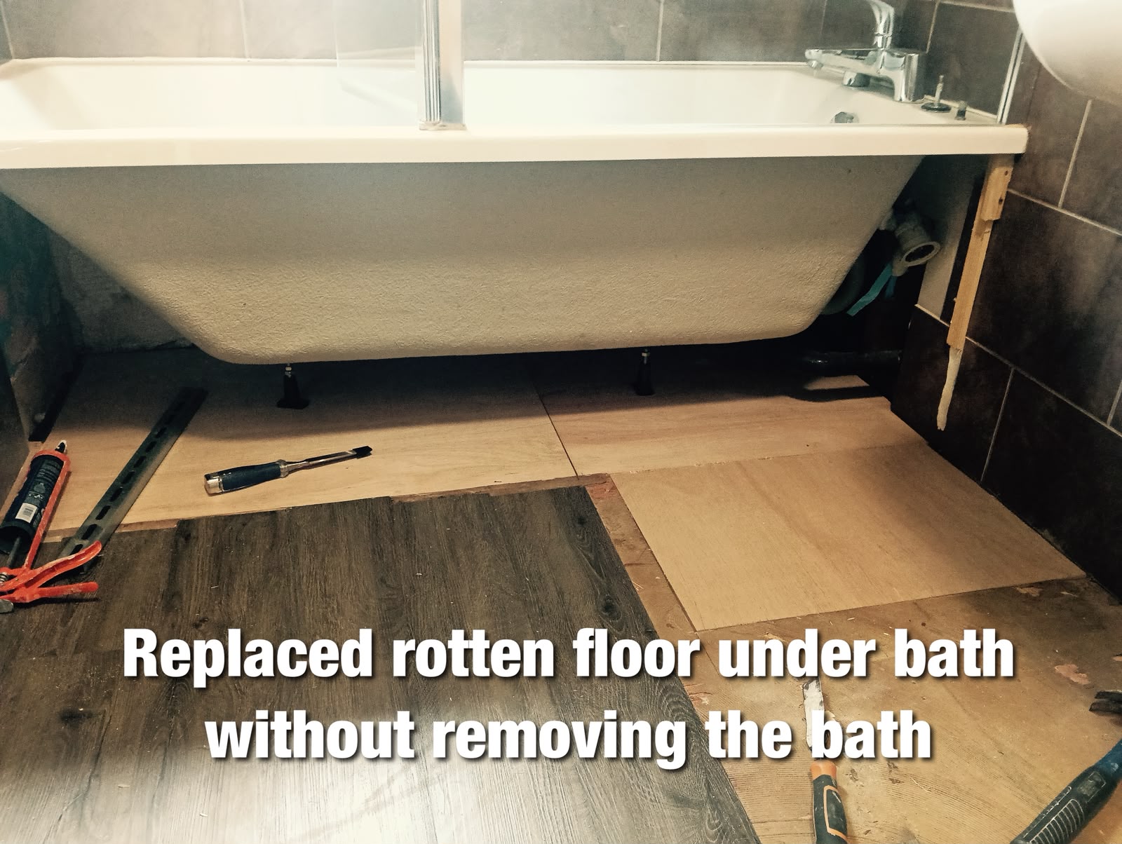 Floor repaired beneath a bath